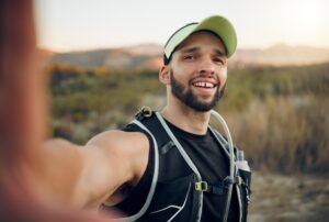 Fitness travel, hiking selfie or sports man in forest or nature for social media, internet or blog