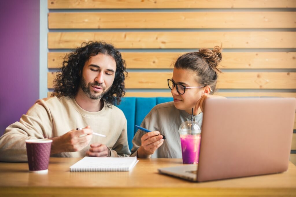 Young European couple studying with online courses