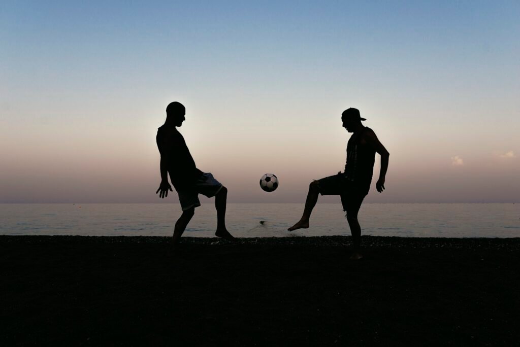 Two friends playing soccer.