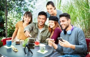 Young people sharing content on streaming platform at coworking cafeteria