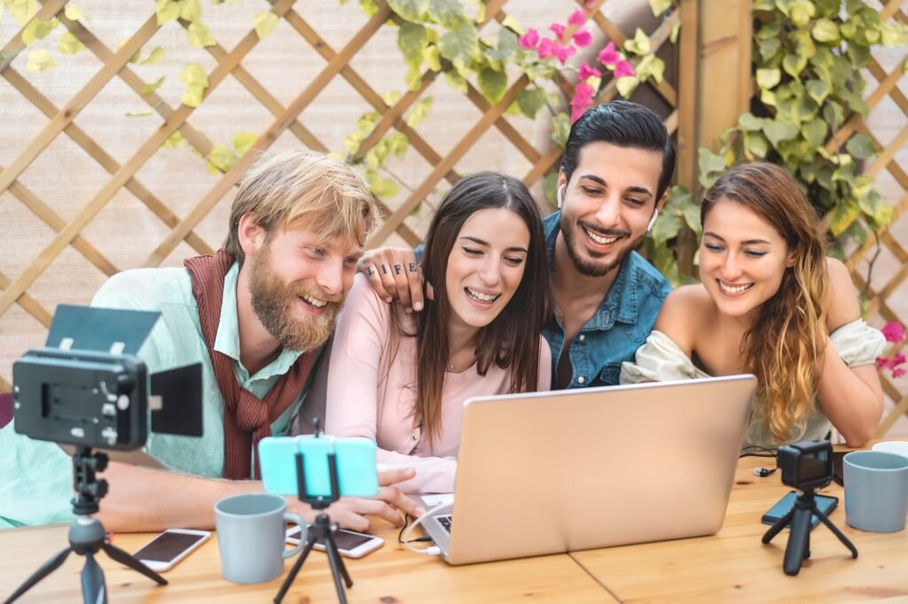 Young vlogger friends filming video for online web channel