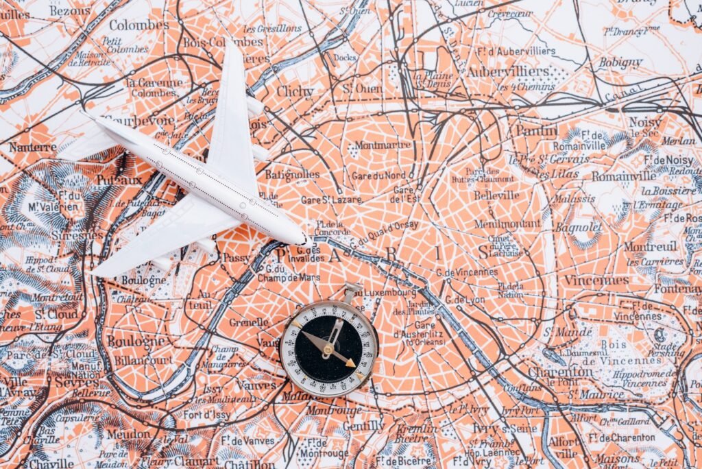 Compass on the background of the map. Magnetic compass and topographic map.