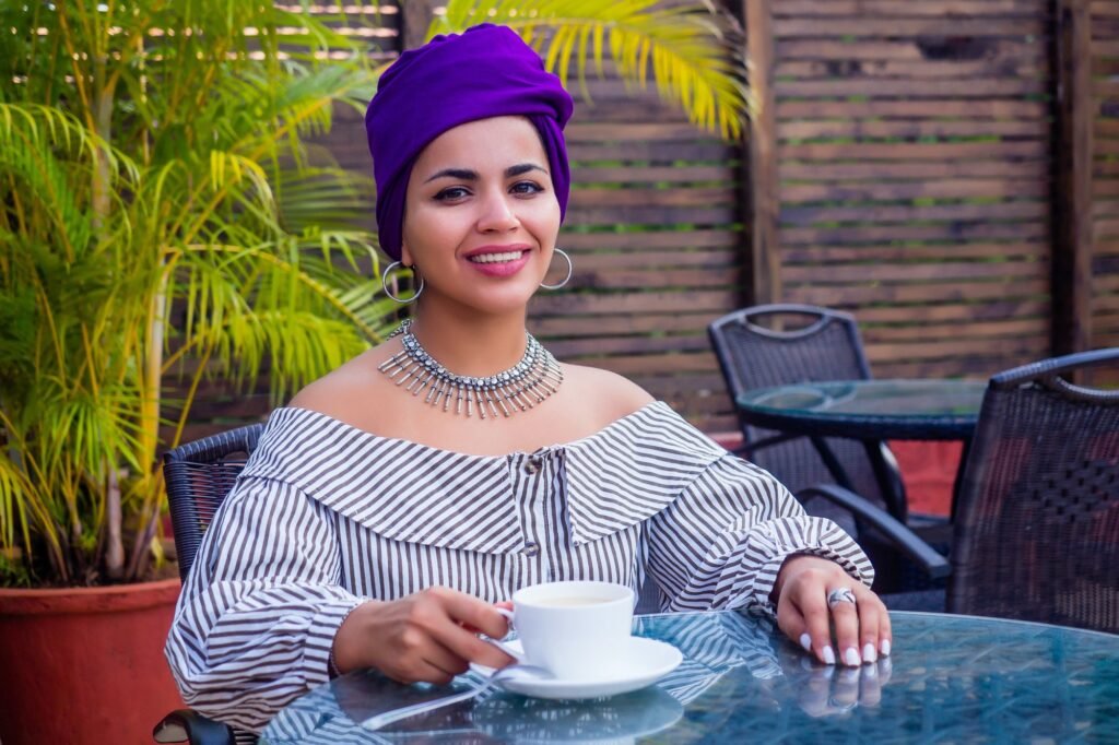 Fashion afro american girl with ethnic turban on head culture coffeebreak
