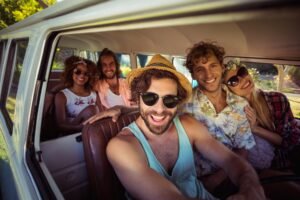 Group of friends travelling in campervan