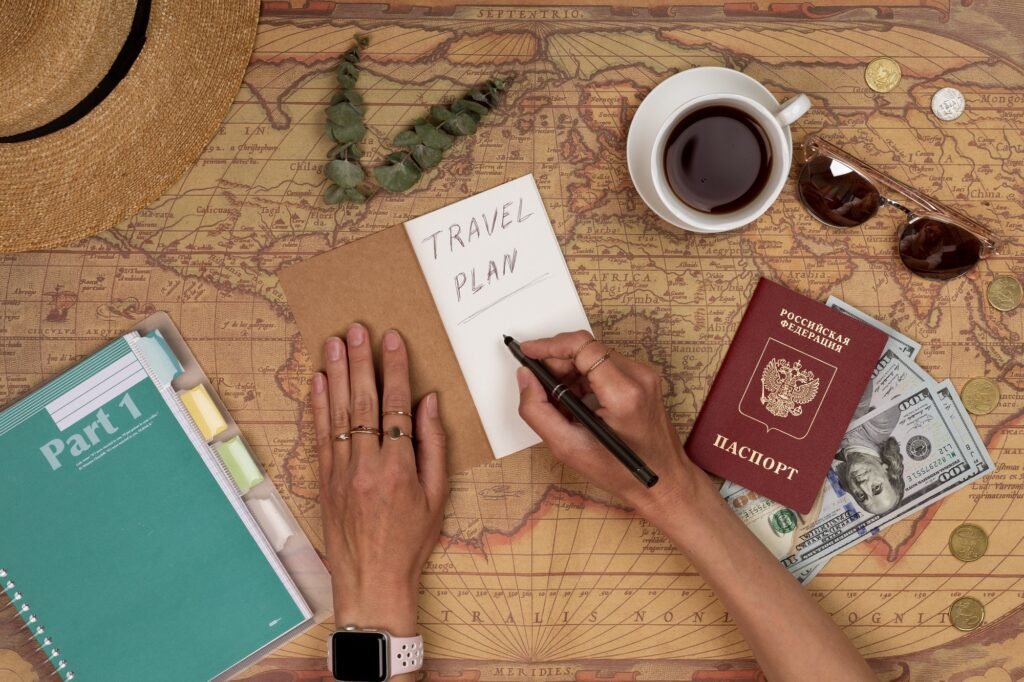 Planning vacation, travel plan, trip vacation using world map with accessories. Top view, flat lay.