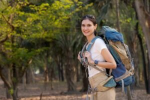 Young woman backpacking ready for a solo hike