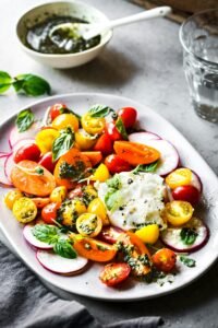 Burrata with colorful Cherry Tomatoes Salad with homemade Pesto