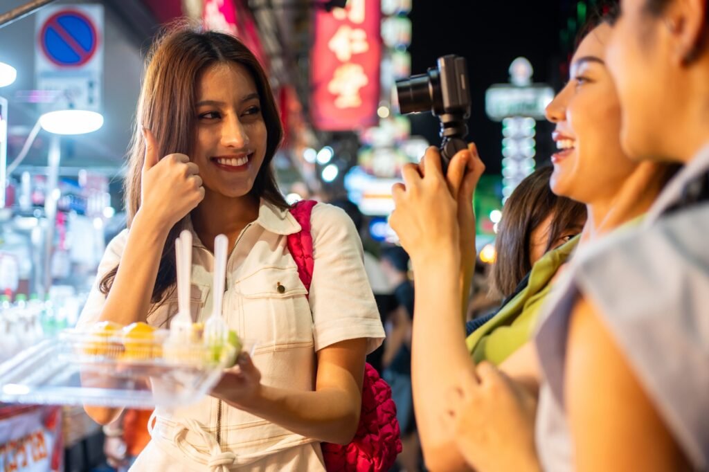 Asian young women friend record vlog while travel outdoor in the city. A