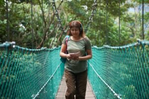 Tourist on bridge, KL Forest Eco Park, Kuala Lumpur, Malaysia
